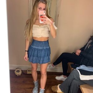 White crow blue skirt